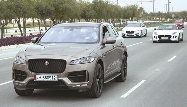 The Jaguar F-PACE (front), the Jaguar F-TYPE SVR (right), and the Range Rover Evoque Convertible each won an award at MECOTY.