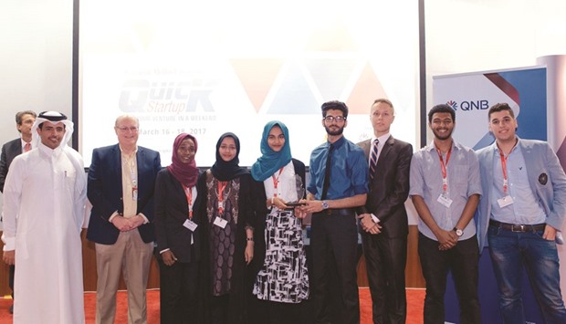 The members of the first place winning team in Quick Startup 2017 are seen with officials.