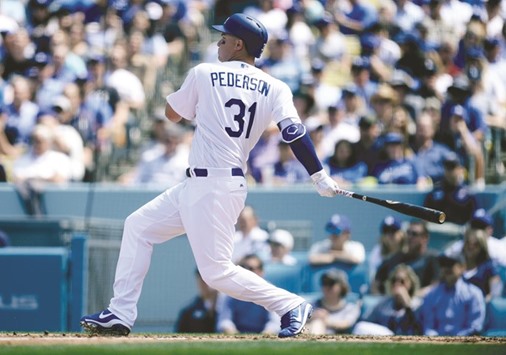 Los Angeles Dodgers centre fielder Joc Pederson hits a grand slam home run in the third inning against the San Diego Padres during the opening day game at Dodger Stadium.  PICTURE: USA TODAY Sports