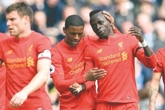 Liverpool have yet to discover the full extent of the Sadio Mane (right) knee injury. (AFP)