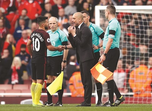 Manchester City under Pep Guardiola (centre) were one of the teams expected to challenge for the title, but they remain vulnerable in defence. (Reuters)