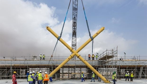 Workers elevate the first steel structure for the upper tier of Al Bayt stadium in Al Khor. PICTURE: Konstantinos Zagkas.