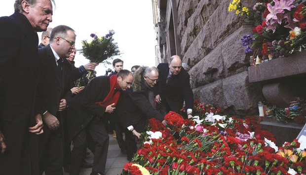 Representatives of European consulates lay flowers yesterday in honour of the victims of the blast outside the Technological Institute metro station in Saint Petersburg.