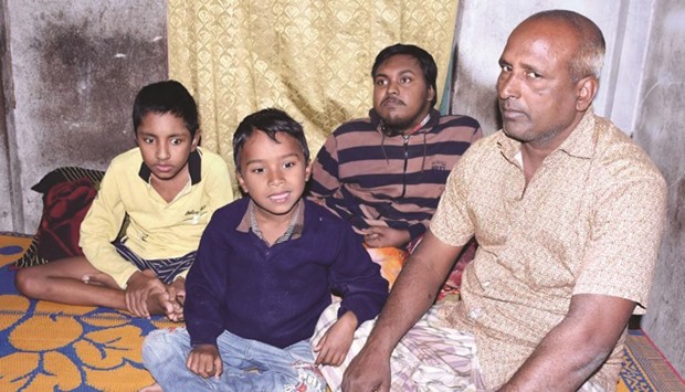 In this file photo, Tofazzal Hossain, right, is seen with his two sons and grandson (second left) in Meherpur, 285km from Dhaka.