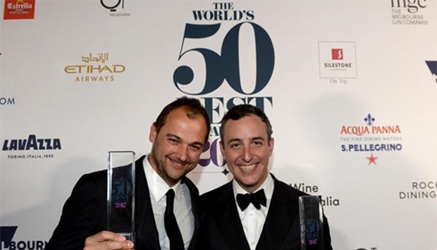 Daniel Humm (left) and Will Guidara pose with their trophies after winning the Worldu2019s Best Resaurant award in Melbourne on Wednesday.