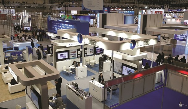 Booths are seen at Gastech, the worldu2019s biggest expo for the gas industry, in Chiba, Japan. Producers of liquefied natural gas (LNG), facing calls for flexibility and greater competition from other fuels, are taking on more risk and learning to trade, just like any other commodities dealers.