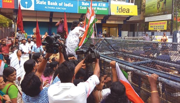 Activist of the Congress party stage a protest outside the police headquarters in Thiruvananthapuram.