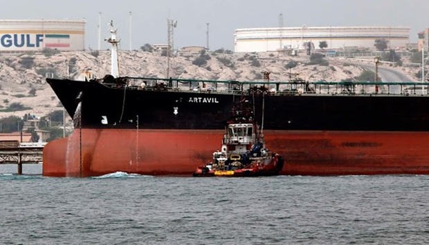 An Iranian tanker docking at the platform of the oil facility in the Khark Island
