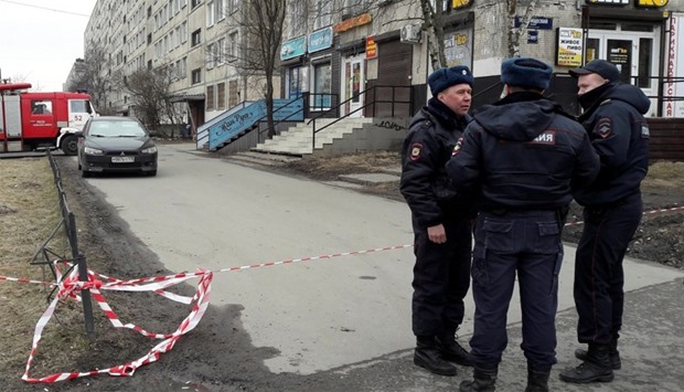 Russian police officers secure a residential area in St. Petersburg