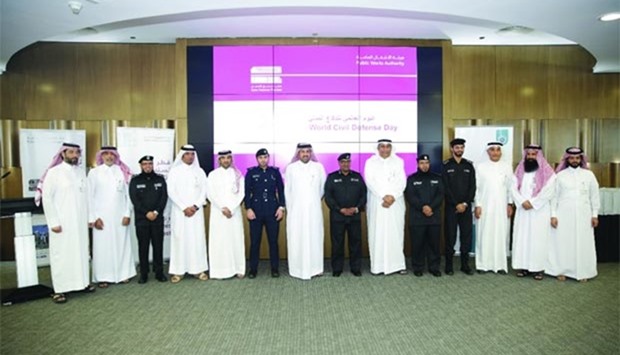 Ashghal and civil defence officials at the announcement of tie-up between the two organisations.