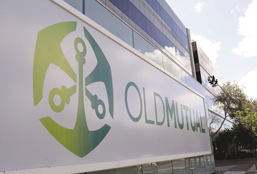 Workers clean windows outside the Cape Town headquarters of Old Mutual. The Anglo-South African financial services company, which is working with financial advisers on the stake sale plan, could sell its holding in the 13-year-old life insurance joint venture with Guodian Corp to one or more local firms, sources said.