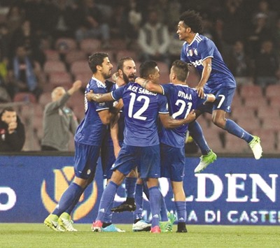 Juventusu2019 Gonzalo Higuain (second left) celebrates with teammates after scoring against Napoli during the Italian Cup semi-final. (AFP)