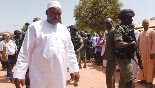 President Adama Barrow arrives at a polling station in Bakau yesterday.