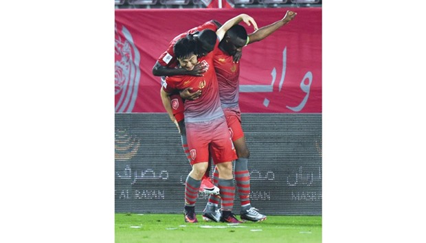 Lekwhiyau2019s South Korean star Nam Tae-hee is congratulated by teammates after he scored the winning goal against Al Ahli yesterday. Picture: Noushad Thekkayil