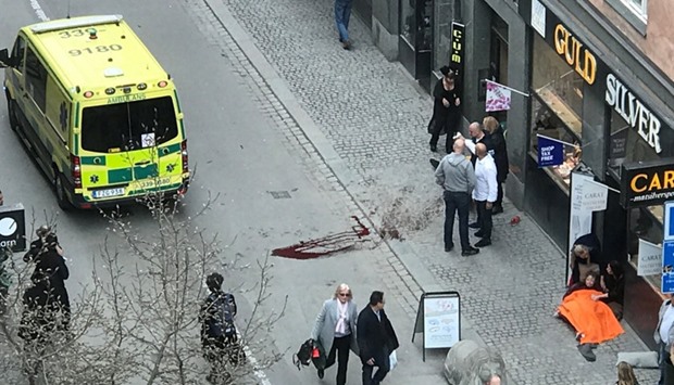Ambulance in a street near the site were a truck was driving into a crowd in central Stockholm.