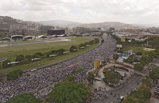 Venezuelan opposition activists gather on Thursday to protest against the Maduro government in Altamira, Chacao municipality, eastern Caracas.
