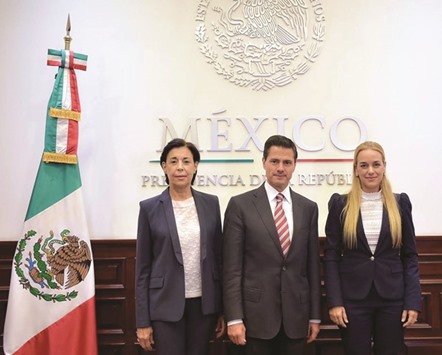 This handout picture released by Lilian Tintoriu2019s press office showing Mexican President Pena Nieto with Tintori (right) and Antonieta Mendoza de Lopez, the mother of imprisoned Venezuelan leader Leopoldo Lopez, during a private meeting in Mexico City.