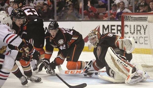 Anaheim Ducks defenseman Josh Manson (second from right) helps goalie John Gibson (right) defend the goal against the Chicago Blackhawks at Honda Center in Anaheim, California, on Thursday. (USA TODAY Sports)