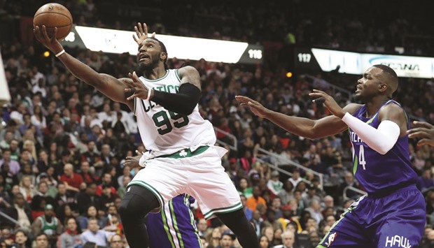 Boston Celtics forward Jae Crowder (left) attempts a shot against Atlanta Hawks forward Paul Millsap (right) in the third quarter of their game at Philips Arena in Atlanta, Georgia, on Thursday. (USA TODAY Sports)