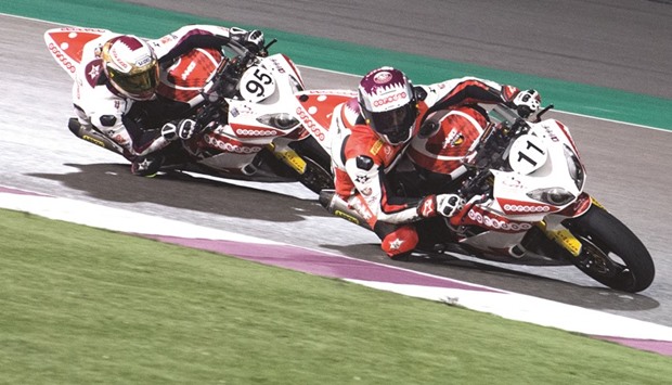 Saeed al-Sulaiti (right) and Meshal al-Naimi had a close battle during the second race of the third round of the Qatar SuperStock 600 at the Losail International Circuit yesterday.