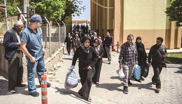 Syrian victims of suspected chemical attack leave the Reyhanli hospital in Hatay yesterday.
