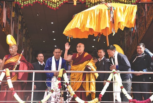 Exiled Tibetan spiritual leader the Dalai Lama arrives to deliver teachings to Buddhist followers at the Yiga Choezin ground in Tawang district near the India-China border in Arunachal yesterday.
