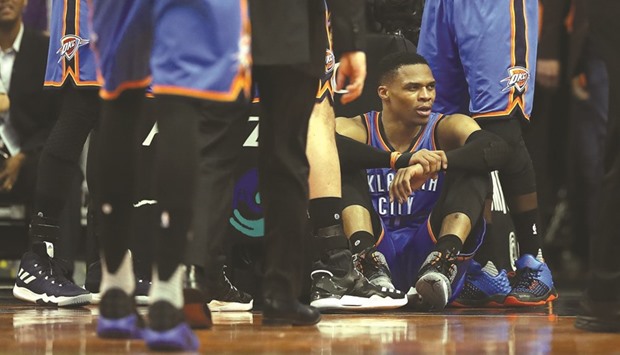 Russell Westbrook of the Oklahoma City Thunder sits on the court after being fouled during the second half of the game.