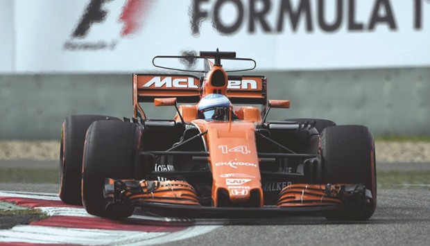 McLarenu2019s Fernando Alonso drives during the qualifying session in Shanghai. (AFP)