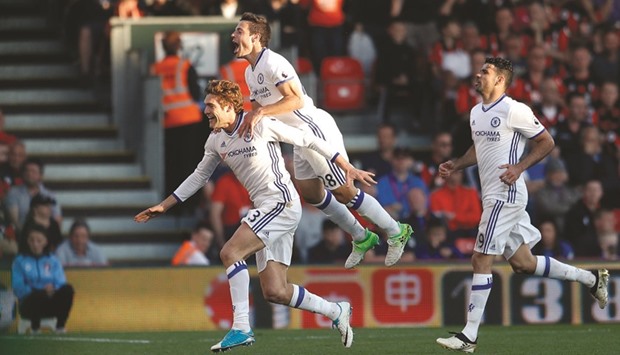 Chelseau2019s Marcos Alonso (left) celebrates with Cesar Azpilicueta after scoring against Bournemouth yesterday. (Reuters)