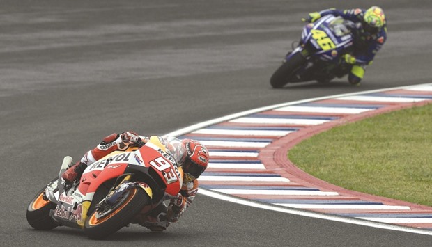 Hondau2019s Marc Marquez (L) rides his Honda ahead of Yamahau2019s Valentino Rossi at the Termas de Rio Hondo circuit in Santiago del Estero, Argentina, yesterday.