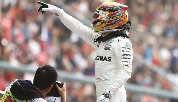 Mercedes driver Lewis Hamilton of Britain reacts after setting pole position in qualifying at the Shanghai International Circuit yesterday.