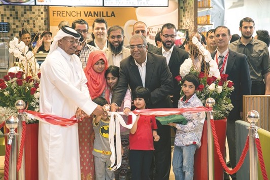 Officials lead the opening of the first Tim Hortons cafu00e9 at Ezdan Mall in Al Wakrah.