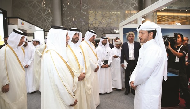 HE al-Mahmoud and other dignitaries at the Nakilat stall at Moushtarayat.