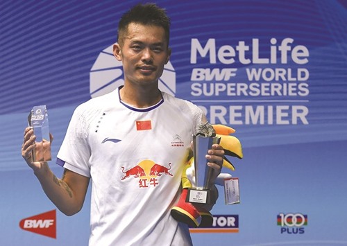 Lin Dan of China poses with the trophy following his singles final victory over Lee Chong Wei of Malaysia at the Malaysia Open Badminton Superseries in Kuching yesterday. (AFP)