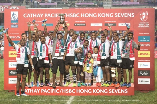Fiji players celebrate after winning the Hong Kong Rugby Sevens Tournament yesterday. (AFP)