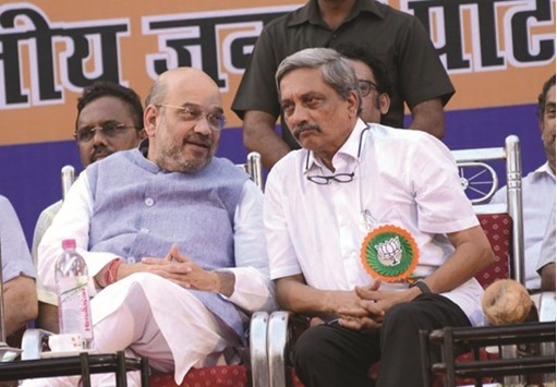 Goa Chief Minister Manohar Parrikar speaks to BJP chief Amit Shah during a party programme in Panaji yesterday.