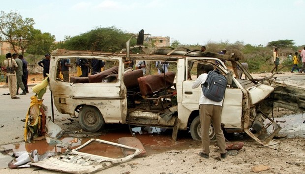 The wreckage of a minibus is seen at the scene of an explosion near a military base in Somalia's capital Mogadishu.