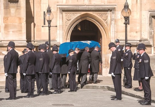 The coffin of police constable Keith Palmer, killed in the March 22 Westminster terror attack, is carried past an honour guard composed of Palmeru2019s fellow officers from the Parliamentary and Diplomatic Protection Command (PaDP) into the chapel of St Mary Undercroft within the Palace of Westminster in central London yesterday, ahead of the funeral tomorrow.