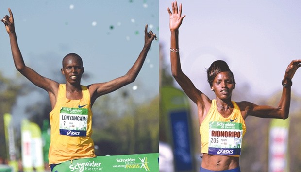 Paul Lonyangata (L) crosses the finish line to win the 41st Paris Marathon in Paris as does his wife Purity Rionoripo (R) to make it a memorable day for the couple.