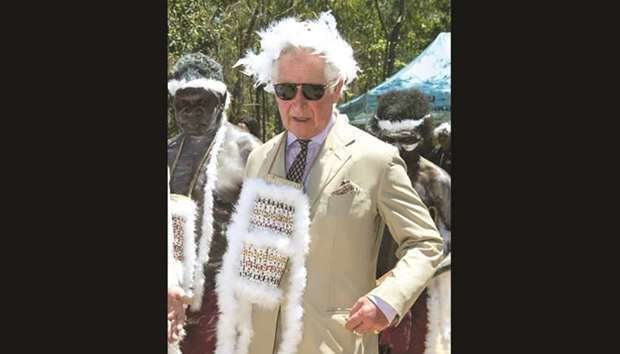 Prince Charles visits Mount Nhulun for a ceremonial welcome with leaders of the Dhimurru and Rirratjingu Aboriginal Corporations, in Australia yesterday.
