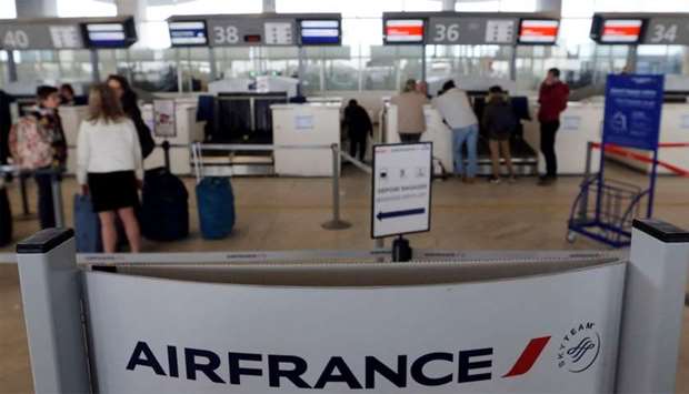 Passengers arrive at the Air France check-in at Bordeaux-Merignac airport, as Air France pilots, cabin and ground crews unions call for a strike over salaries in Merignac near Bordeaux