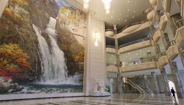 A man walks through the lobby of the 1,500-seat East Pyongyang Grand Theatre in Pyongyang on Sunday. Top South Korean musical acts including a K-pop girlband are set to hold a rare concert in North Korea on Sunday evening