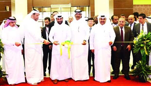 Dignitaries lead the ribbon-cutting ceremony to open Al Meera's new store in Aba Al Heran.