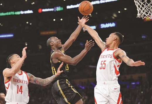 Los Angeles Lakers guard Andre Ingram (20) moves to the basket against Houston Rockets guard Tim Quarterman (55) and guard Gerald Green (14) during the second half  at Staples Center. PICTURE: Gary A. Vasquez u2013USA TODAY Sports