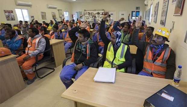 A group of workers are seen during a programme organised by the SC.