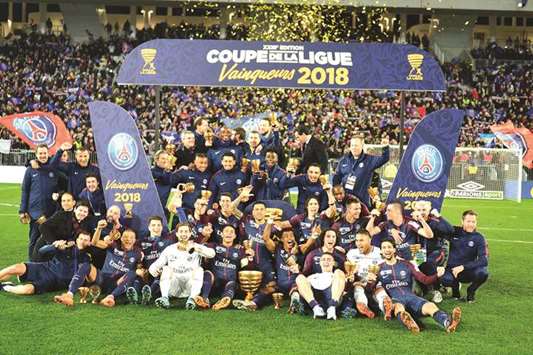 PSG players celebrate after their victory in the French League Cup final against Monaco at The Matmut Atlantique Stadium in Bordeaux. (AFP)