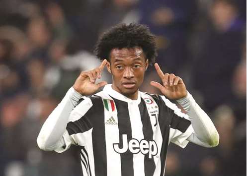 Juventusu2019 Juan Cuadrado celebrates after scoring their second goal against AC Milan in Turin. (Reuters)