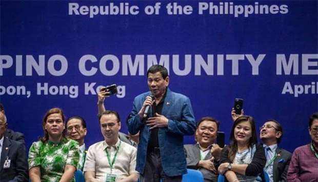 Philippines President Rodrigo Duterte sings on stage at an event with the Filipino community during his visit to Hong Kong on Thursday.