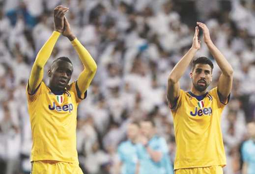 Juventusu2019 Blaise Matuidi and Sami Khedira look dejected as they applaud fans after the match against Real Madrid on Wednesday.