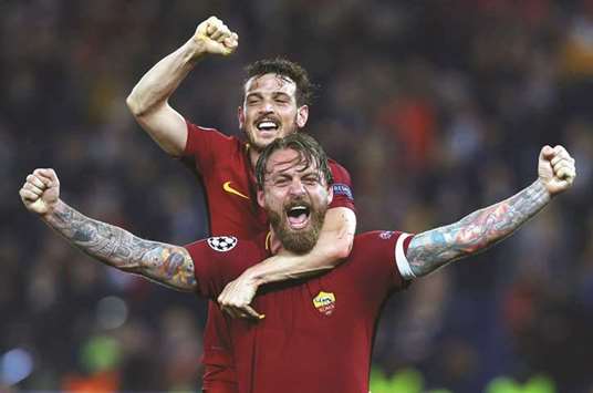 Romau2019s Daniele De Rossi and Alessandro Florenzi celebrate after the match  against Barcelona on Tuesday.